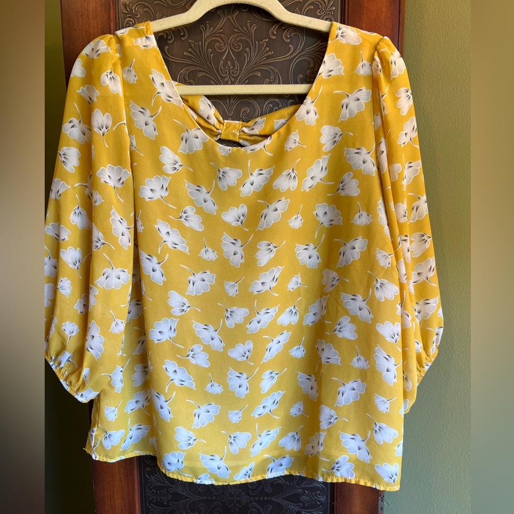 a. n. a. A New Approach flowy blouse with bow detail at back neckline.